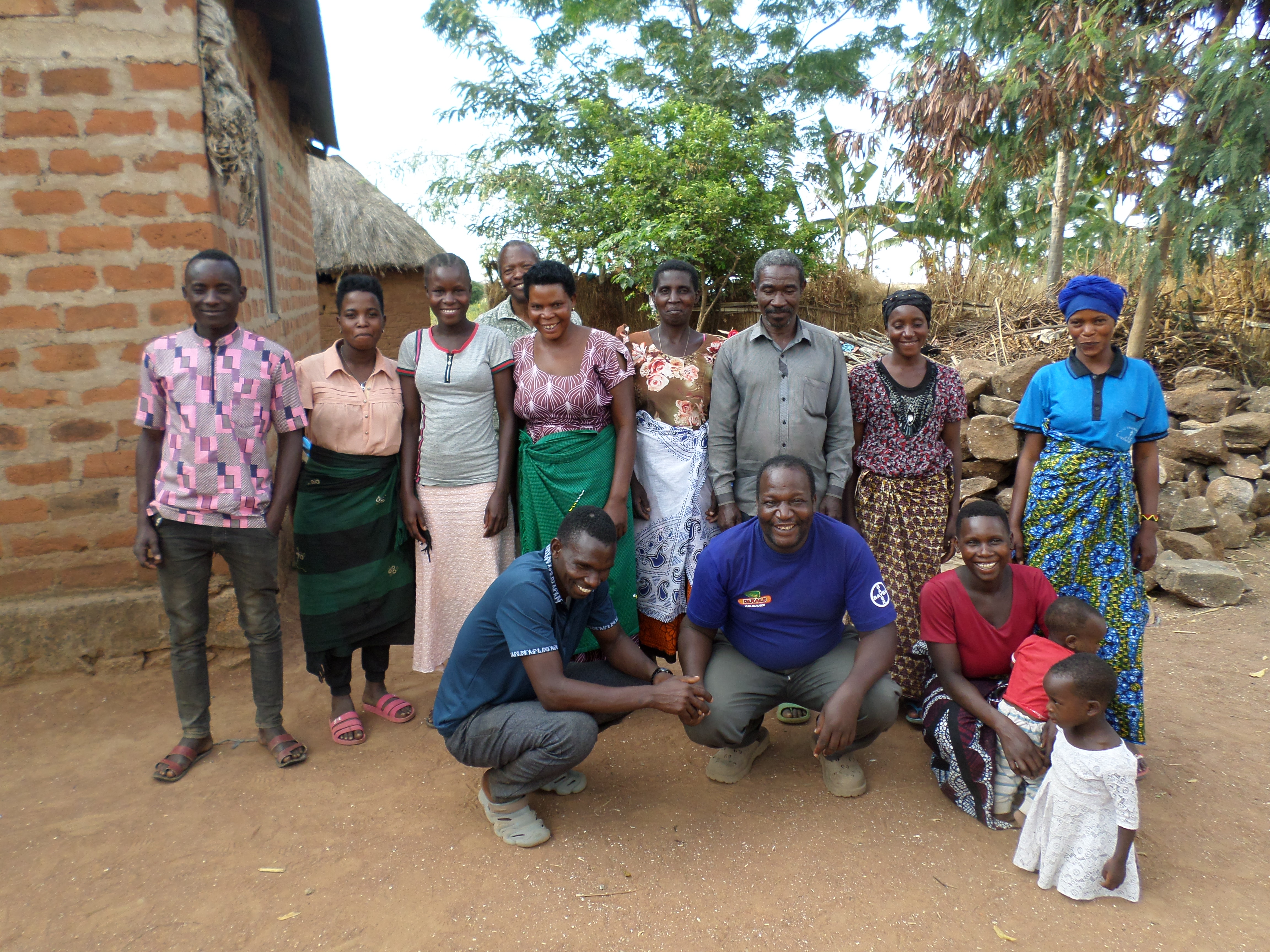 Group of diverse farmers and entrepreneurs collaborating in a sunlit field